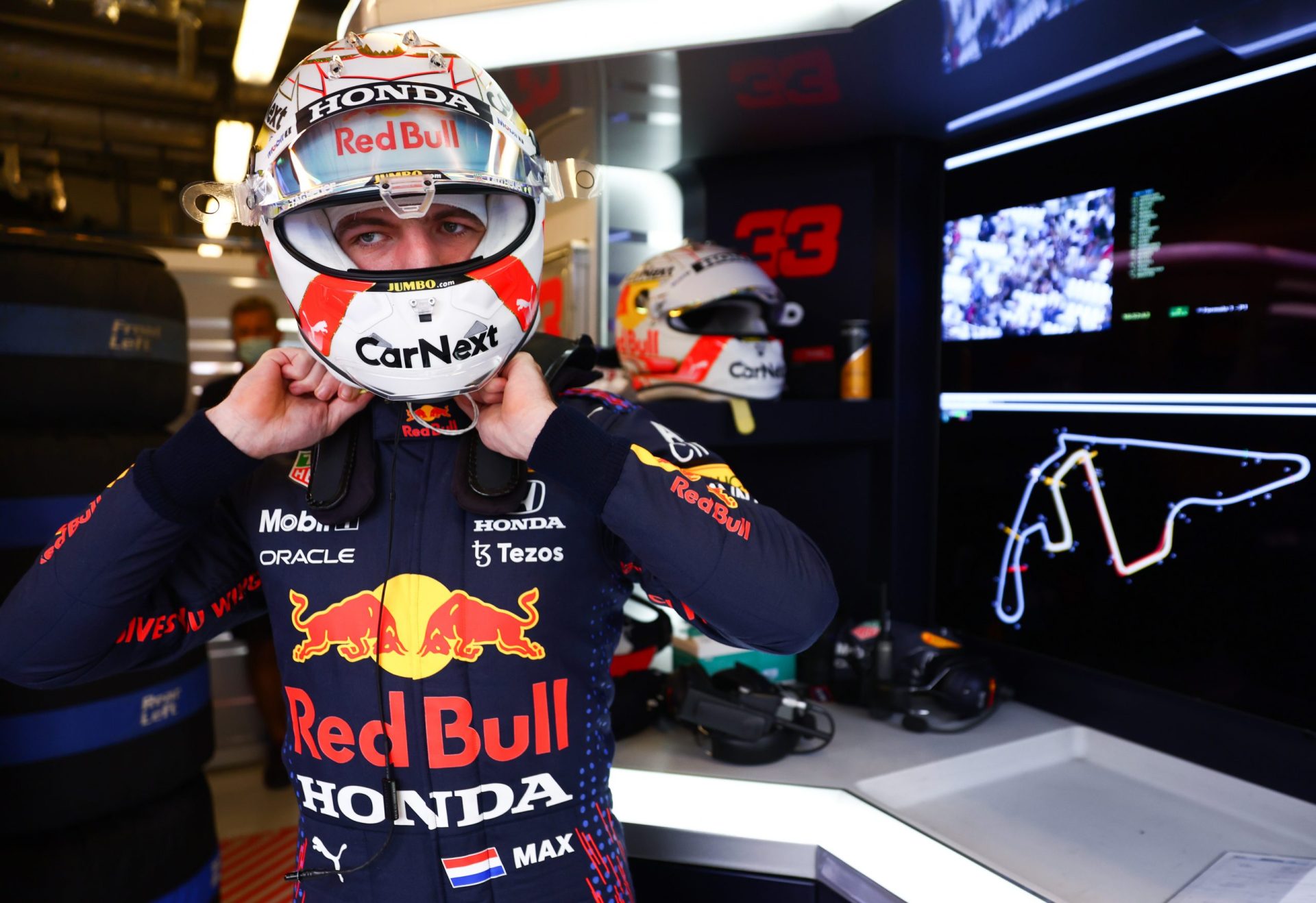 ABU DHABI, UNITED ARAB EMIRATES - DECEMBER 11: Max Verstappen of Netherlands and Red Bull Racing prepares to drive in the garage during qualifying ahead of the F1 Grand Prix of Abu Dhabi at Yas Marina Circuit on December 11, 2021 in Abu Dhabi, United Arab Emirates. (Photo by Mark Thompson/Getty Images) // Getty Images / Red Bull Content Pool  // SI202112110191 // Usage for editorial use only //
