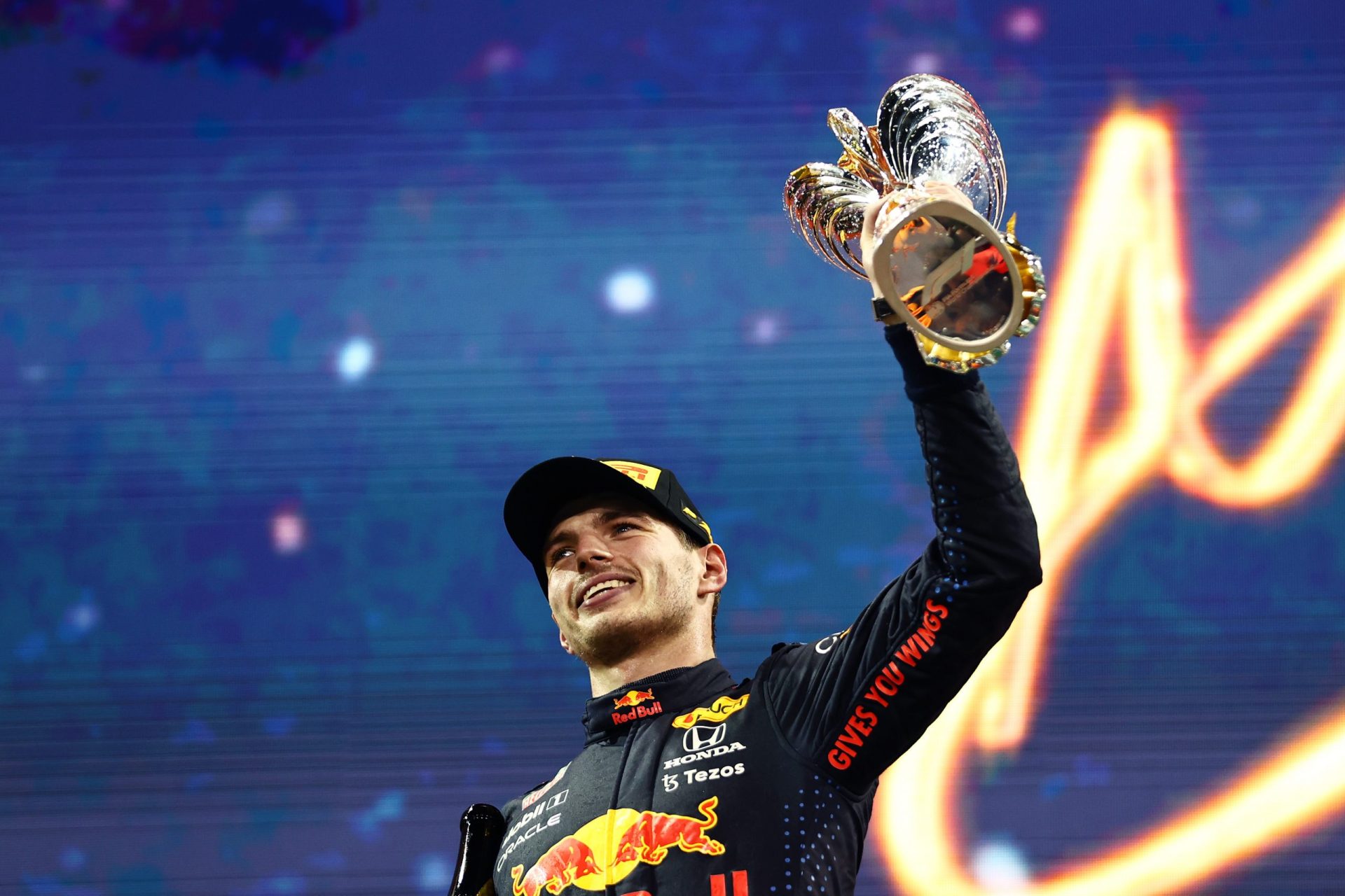 ABU DHABI, UNITED ARAB EMIRATES - DECEMBER 12: Race winner and 2021 F1 World Drivers Champion Max Verstappen of Netherlands and Red Bull Racing celebrates on the podium during the F1 Grand Prix of Abu Dhabi at Yas Marina Circuit on December 12, 2021 in Abu Dhabi, United Arab Emirates. (Photo by Mark Thompson/Getty Images) // Getty Images / Red Bull Content Pool  // SI202112120280 // Usage for editorial use only //