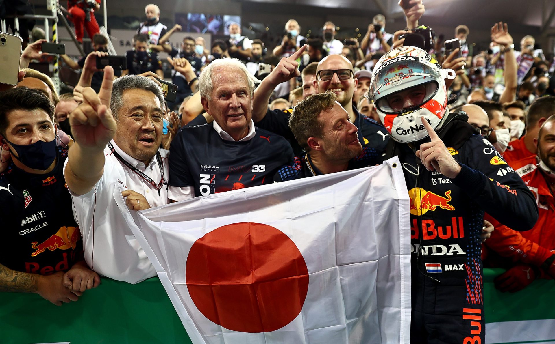 ABU DHABI, UNITED ARAB EMIRATES - DECEMBER 12: Race winner and 2021 F1 World Drivers Champion Max Verstappen of Netherlands and Red Bull Racing celebrates with Red Bull Racing Team Consultant Dr Helmut Marko and Masashi Yamamoto of Honda in parc ferme during the F1 Grand Prix of Abu Dhabi at Yas Marina Circuit on December 12, 2021 in Abu Dhabi, United Arab Emirates. (Photo by Mark Thompson/Getty Images) // Getty Images / Red Bull Content Pool  // SI202112120396 // Usage for editorial use only //