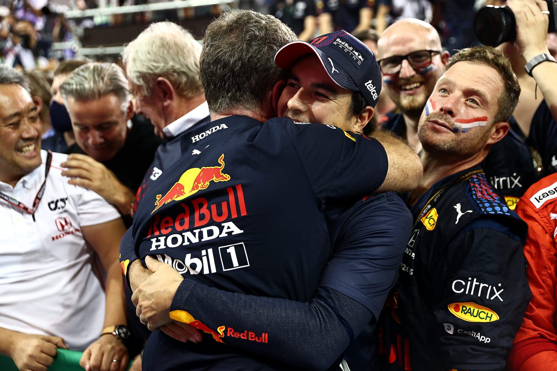 ABU DHABI, UNITED ARAB EMIRATES - DECEMBER 12: Sergio Perez of Mexico and Red Bull Racing celebrates with Red Bull Racing Team Principal Christian Horner in parc ferme during the F1 Grand Prix of Abu Dhabi at Yas Marina Circuit on December 12, 2021 in Abu Dhabi, United Arab Emirates. (Photo by Mark Thompson/Getty Images) // Getty Images / Red Bull Content Pool  // SI202112120470 // Usage for editorial use only //